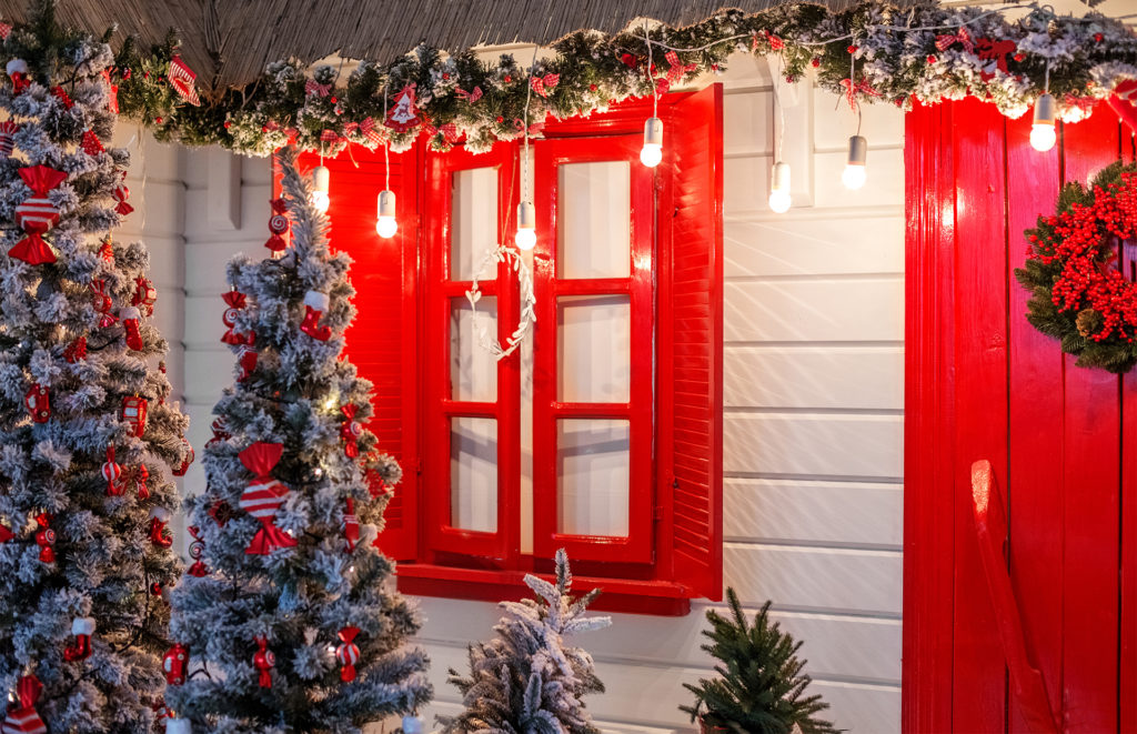 doorscaping red frames red themed trees with giant sweeties
